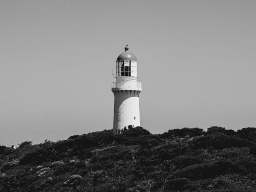 Free A striking black and white image of Cape Schanck Lighthouse surrounded by natural landscape. Stock Photo