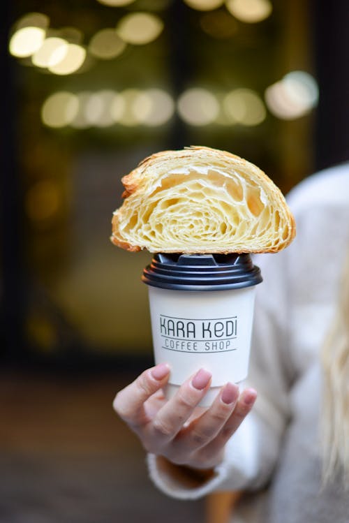 Free Croissant on Cup of Coffee Stock Photo