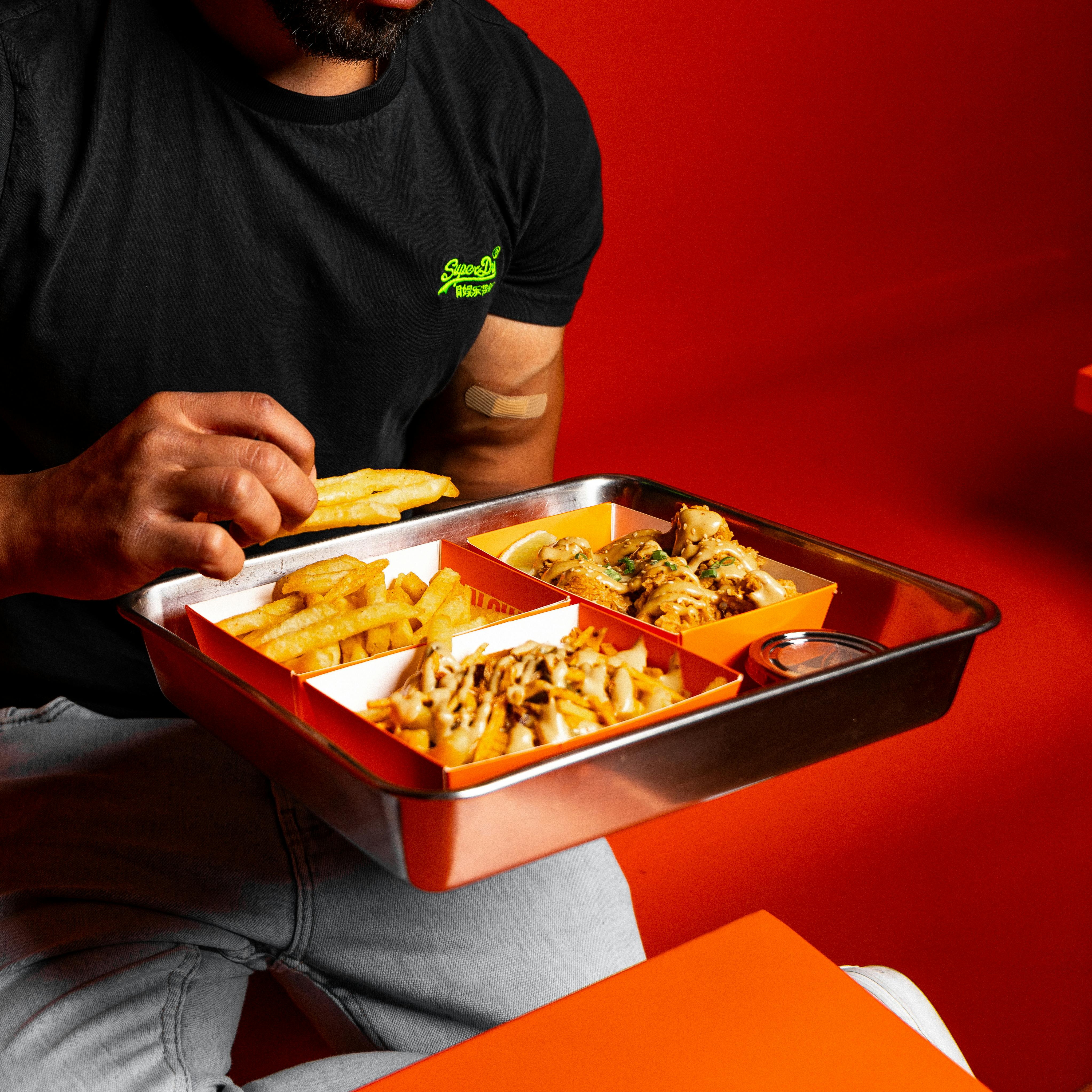 Woman and Man Eating Fast Food on Street · Free Stock Photo