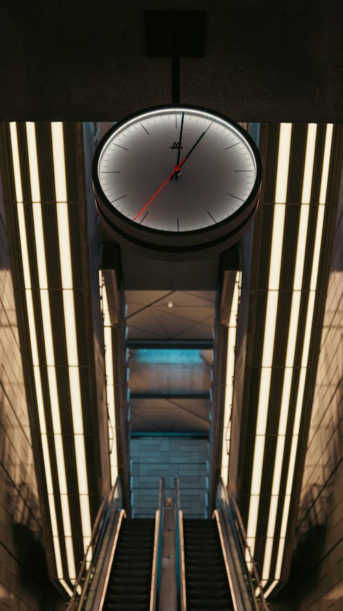 Clock over Subway Station Escalator