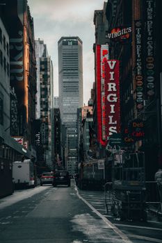 Urban street view in New York City featuring towering skyscrapers and lively atmosphere.