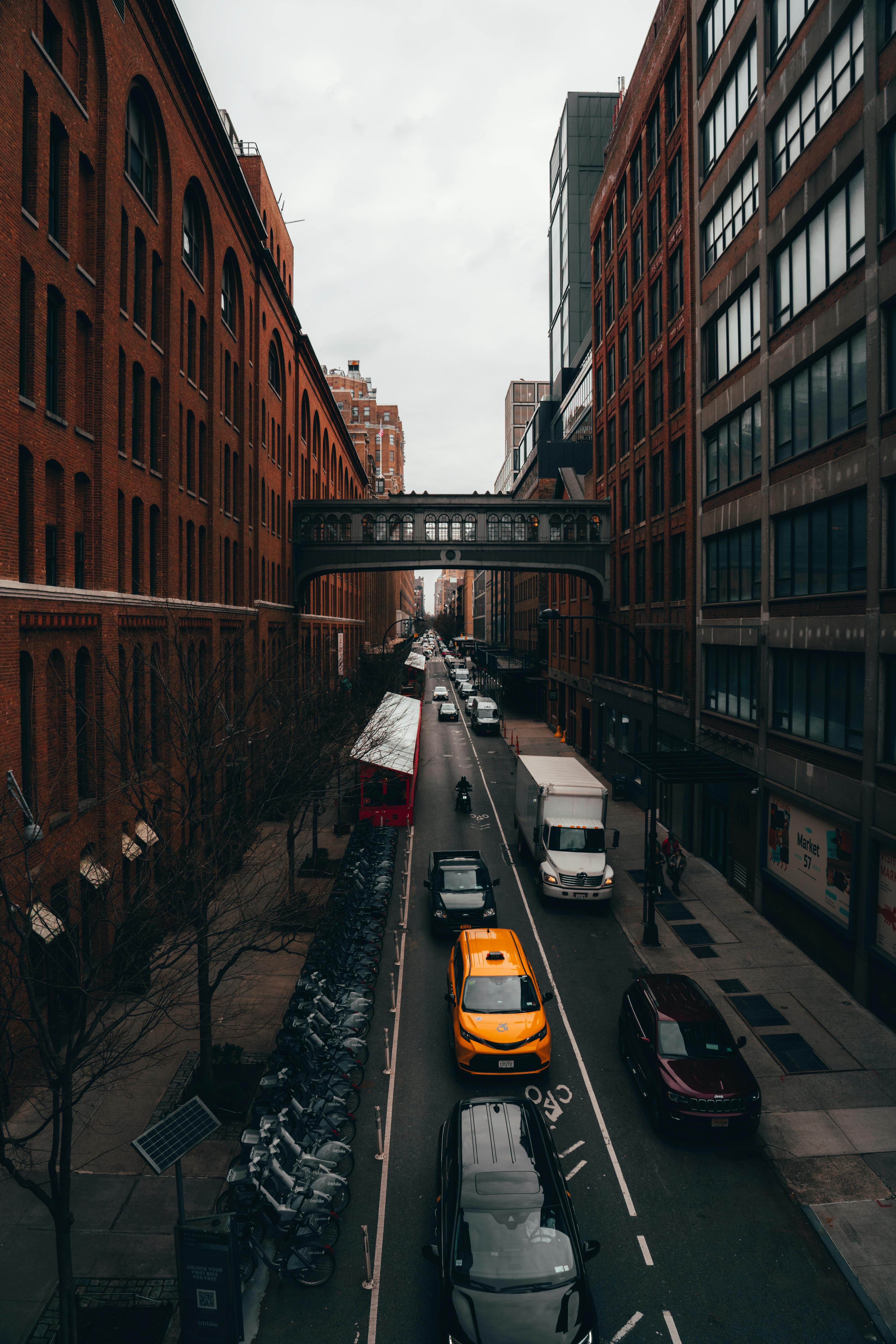 cars in a narrow alley in new york