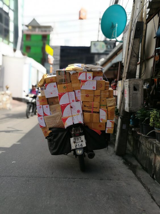 Free Packages on a Scooter Stock Photo