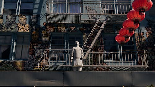 Chinese Statue on Mural over Balconies