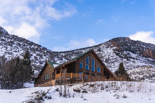 Wooden House in Mountains in Winter