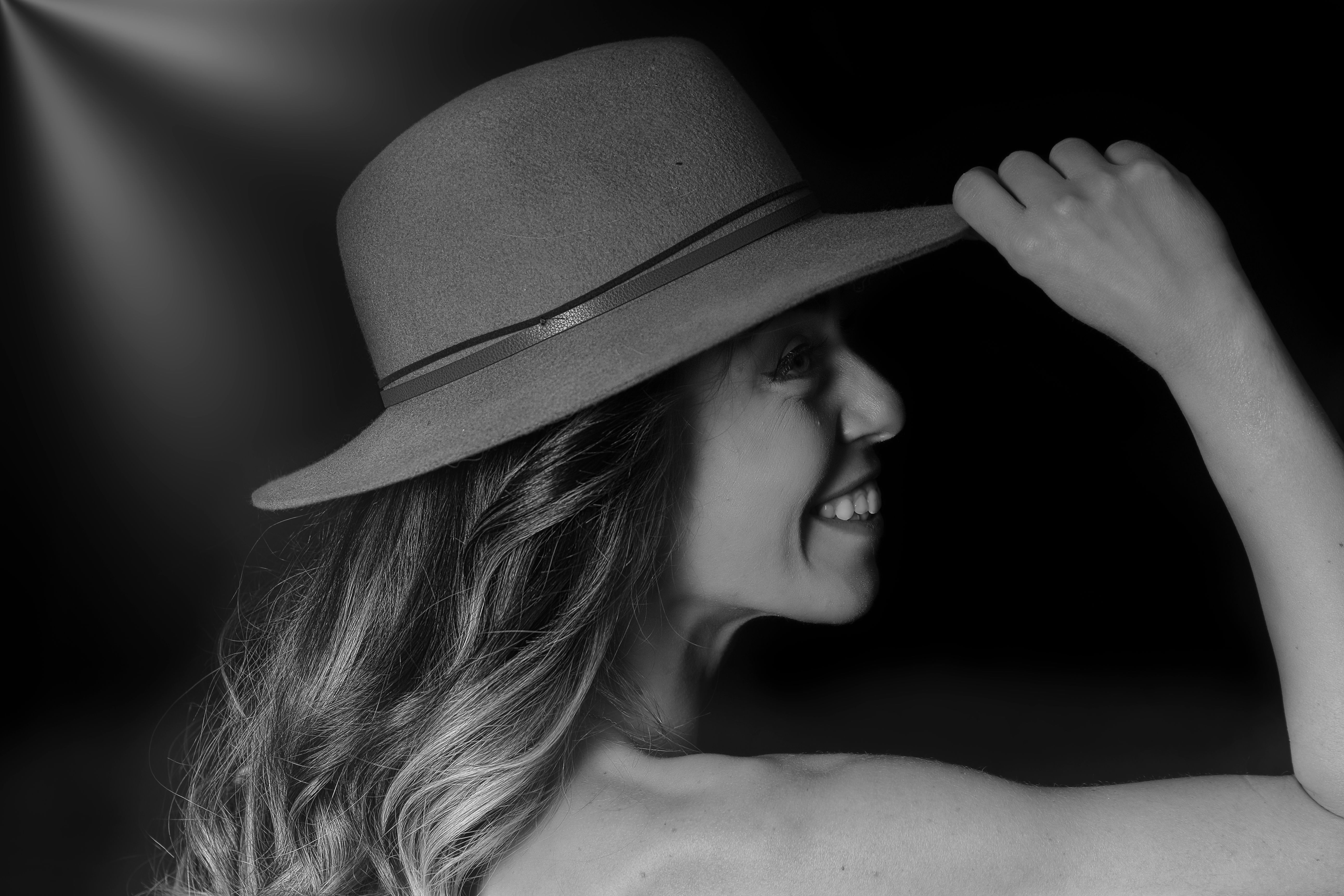 Smiling Woman in Hat in Black and White · Free Stock Photo