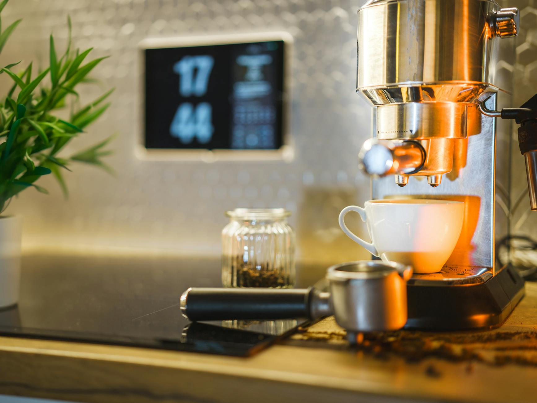Espresso machine setup with coffee beans and mug on countertop, ideal for home baristas.