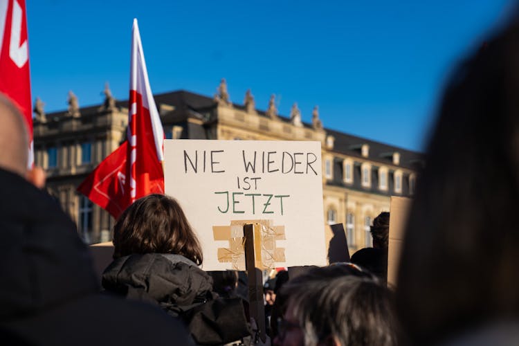 Crowd With Banner On Street