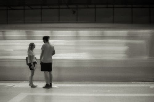 Woman and Man at Metro Station in Black and White