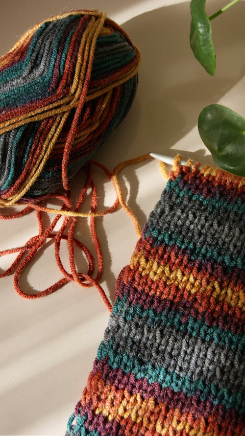 Close-up of Yarn and a Colorful Knitted Needlework 