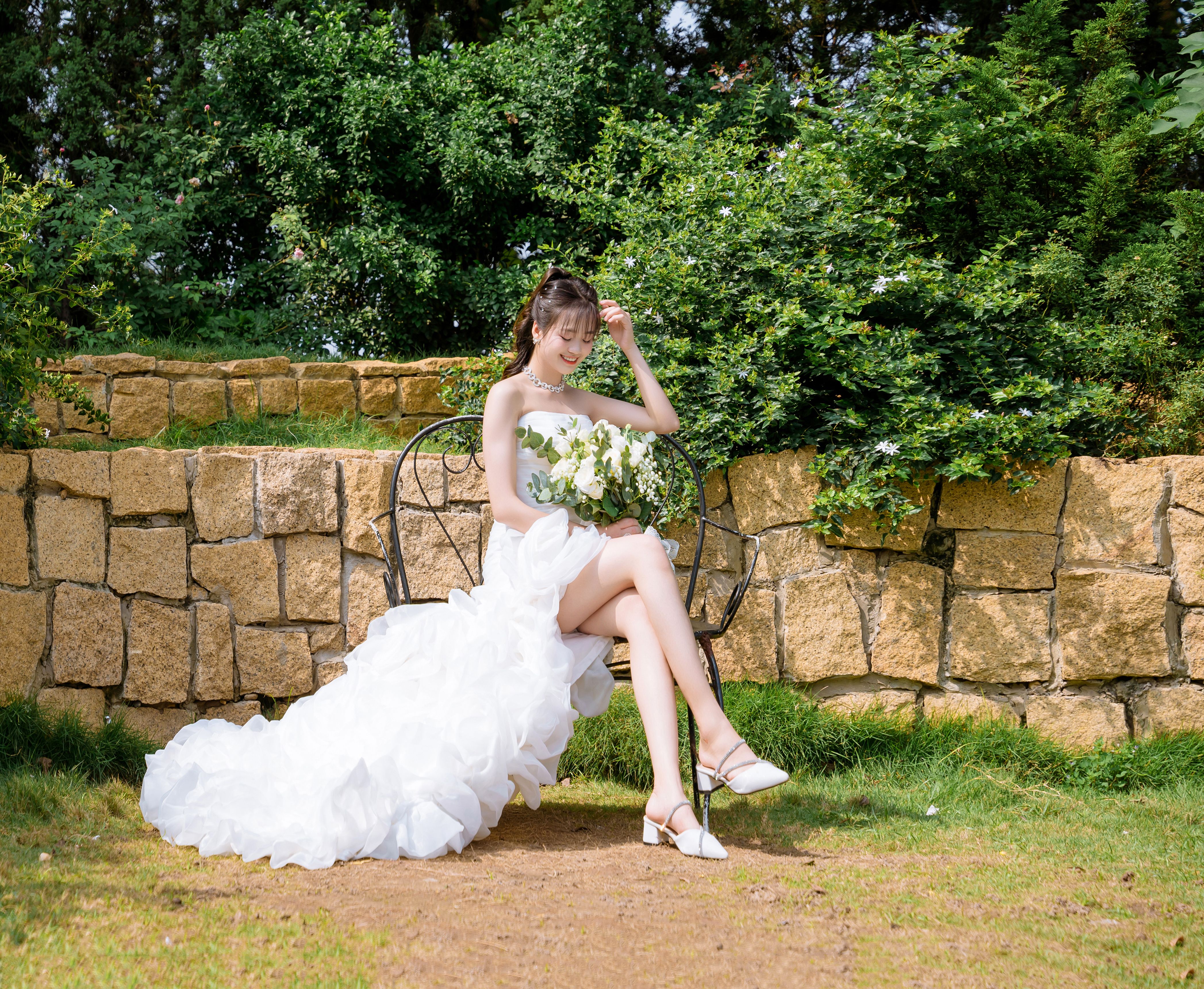 Smiling Bride Sitting in Wedding Dress and with Flowers Bouquet · Free ...