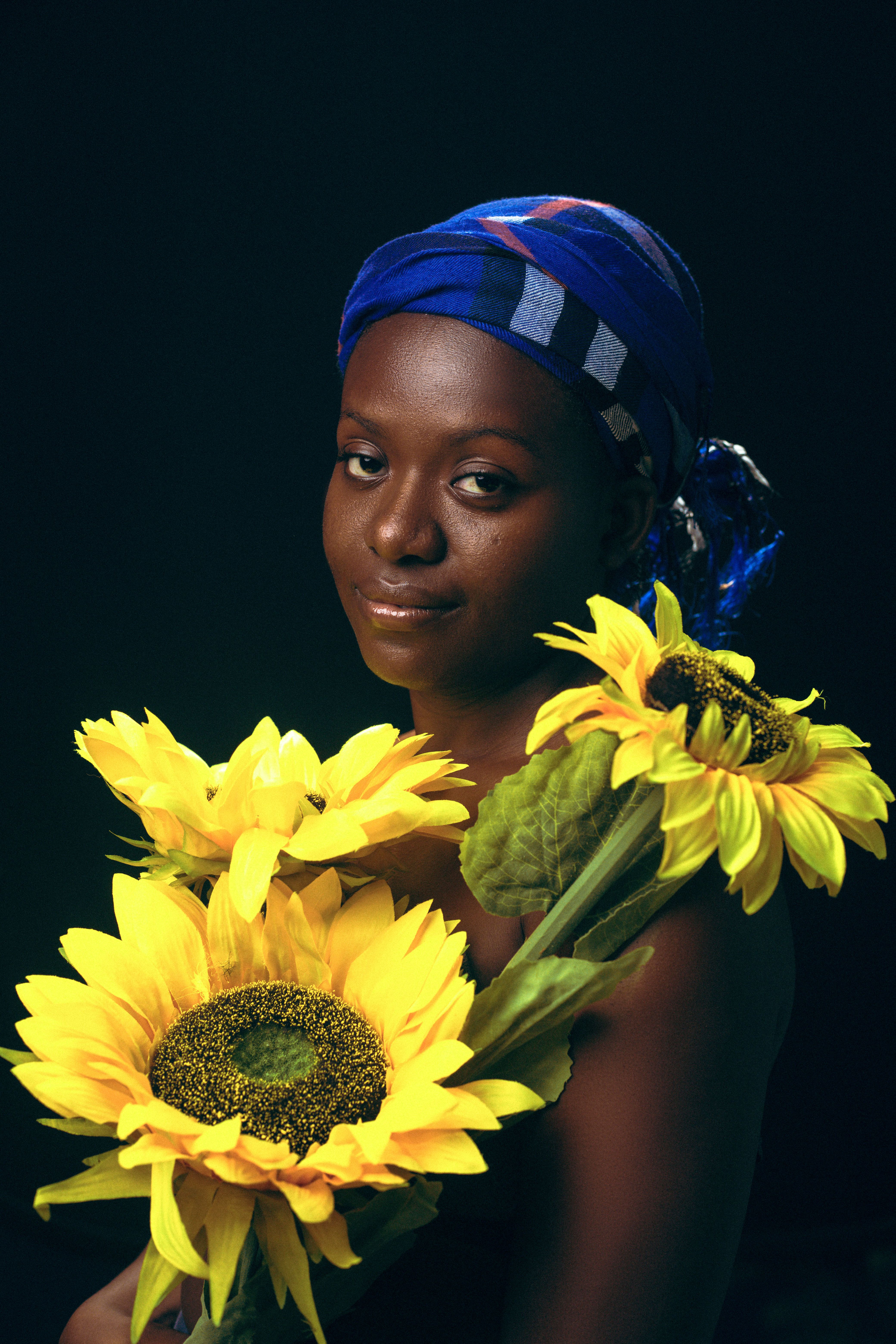 A Woman with Sunflowers · Free Stock Photo