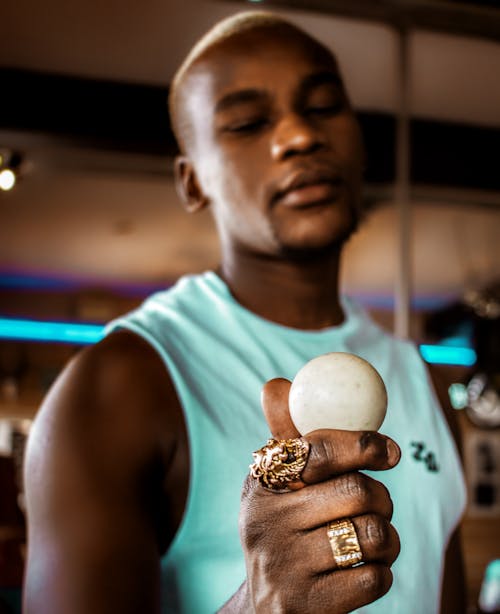 Man Holding White Ball