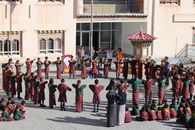 A group of children in traditional clothing participate in a school ceremony in Wangdue Phodrang, Bhutan.