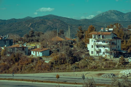 A view of a mountain range with a town in the foreground