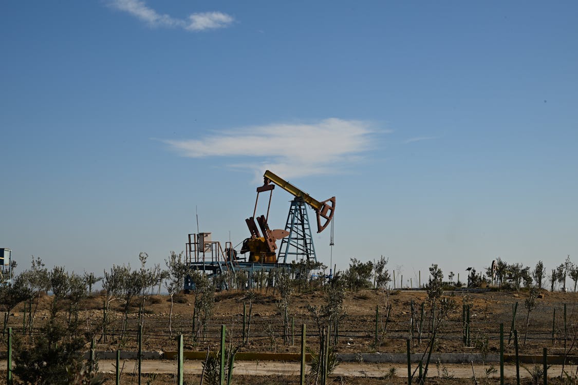 An oil crane on a meadow
