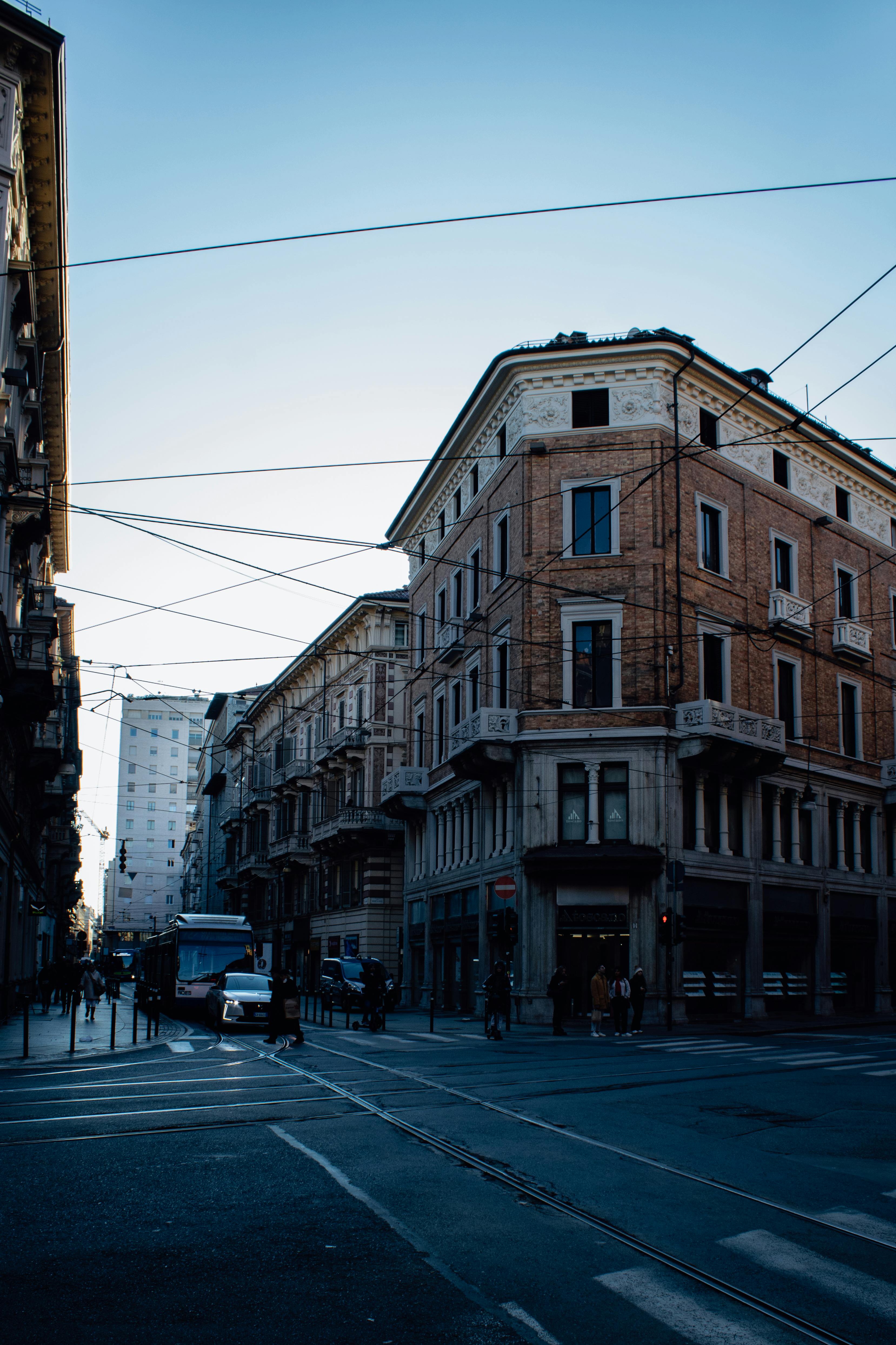 Free Brick townhouse and street view in Turin, Italy showcasing urban architecture. Stock Photo