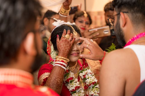 Bride Surrounded by Wedding Guests and Family