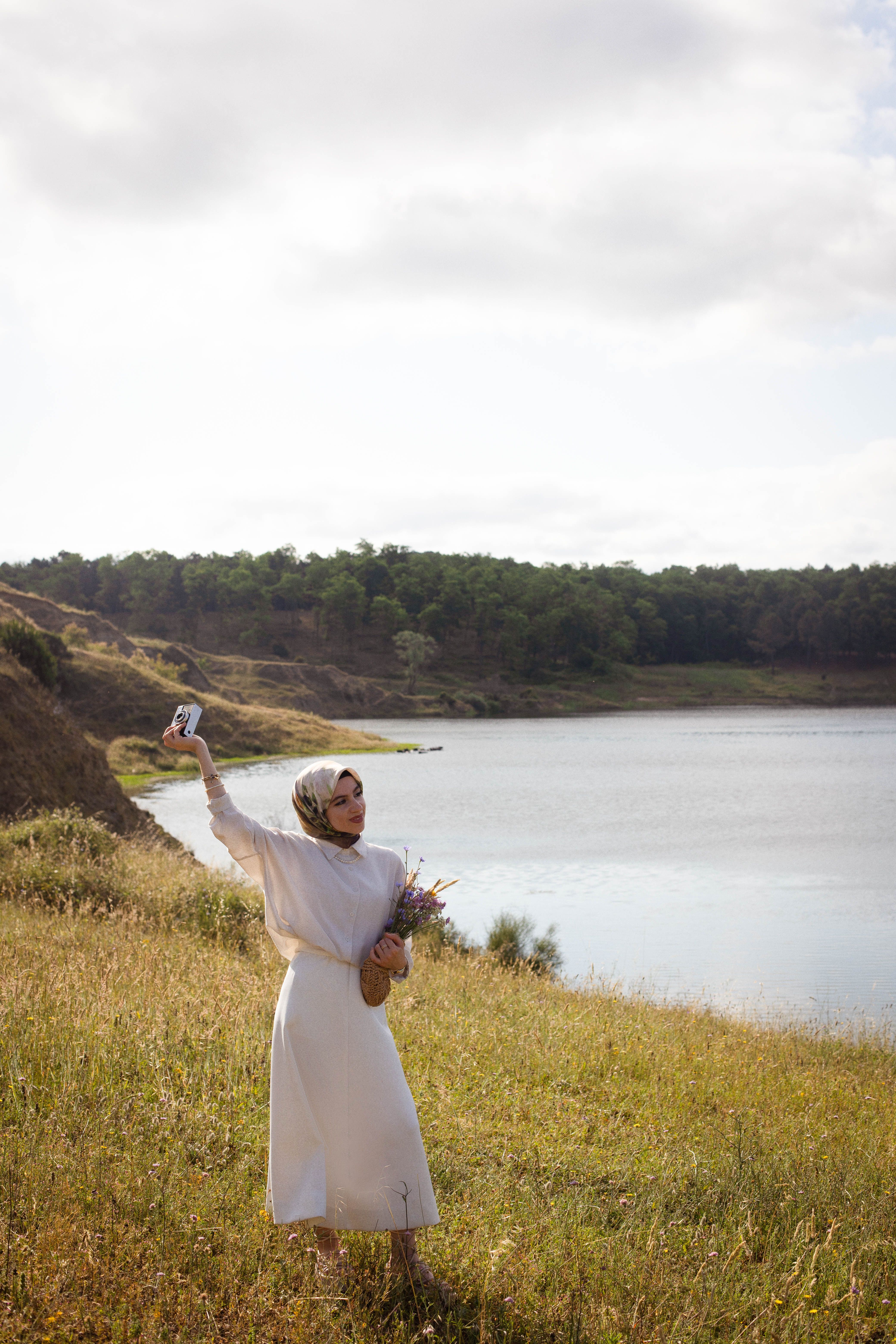 Woman in White Dress and Hijab Standing on Lakeshore · Free Stock Photo
