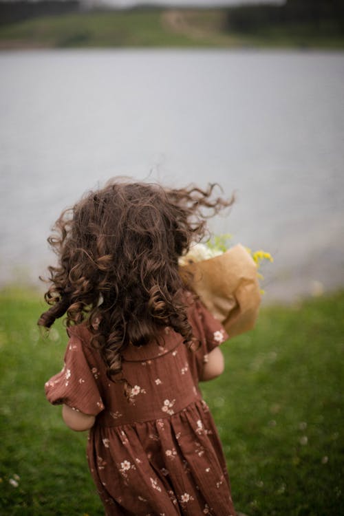 Back View of Girl in Sundress on Lakeshore