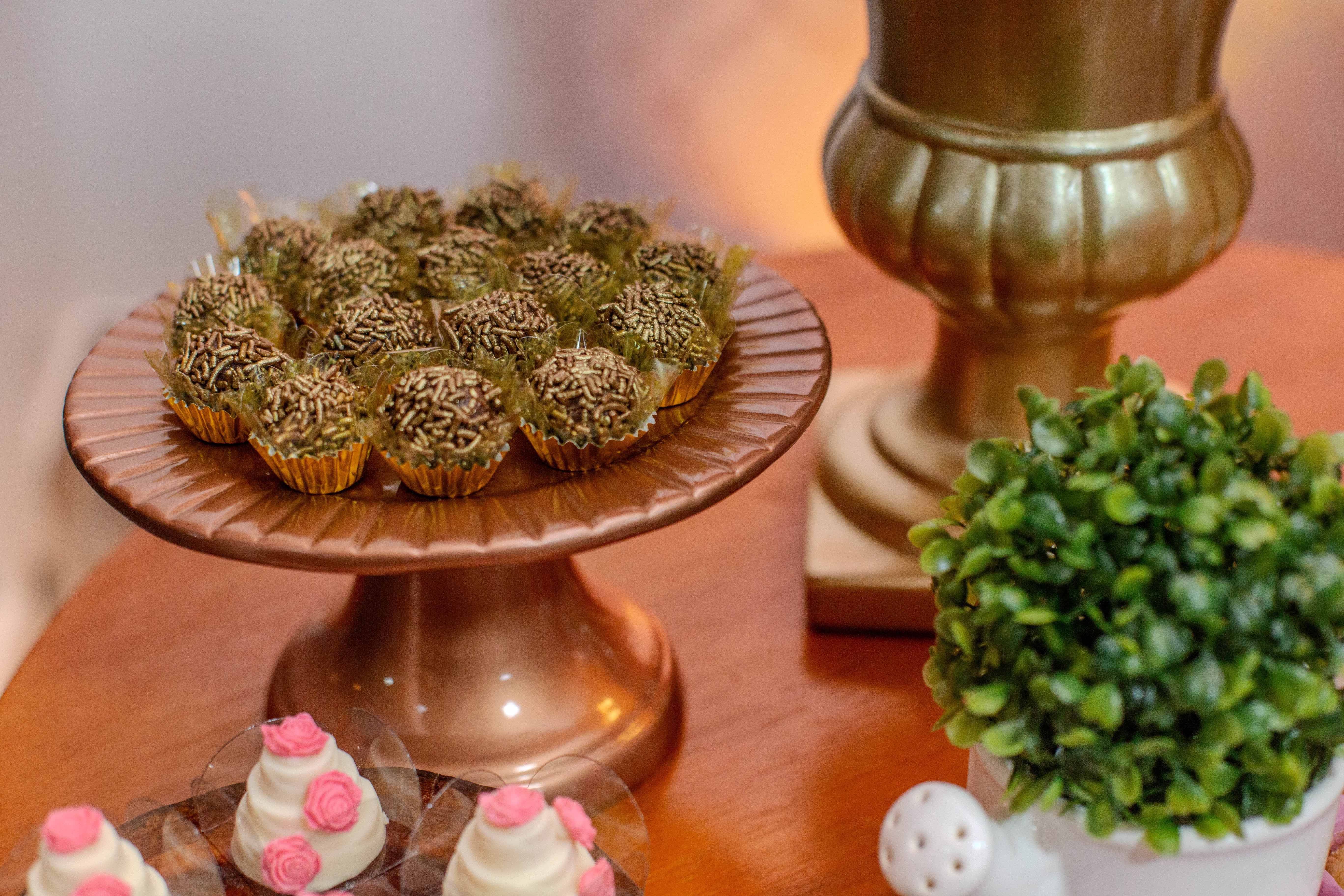 Luxurious dessert table setting featuring chocolate truffles and decorative elements.