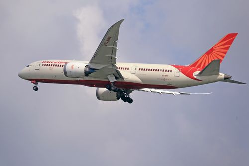 Free Commercial airplane cruising through the sky, symbolizing travel and aviation. Stock Photo