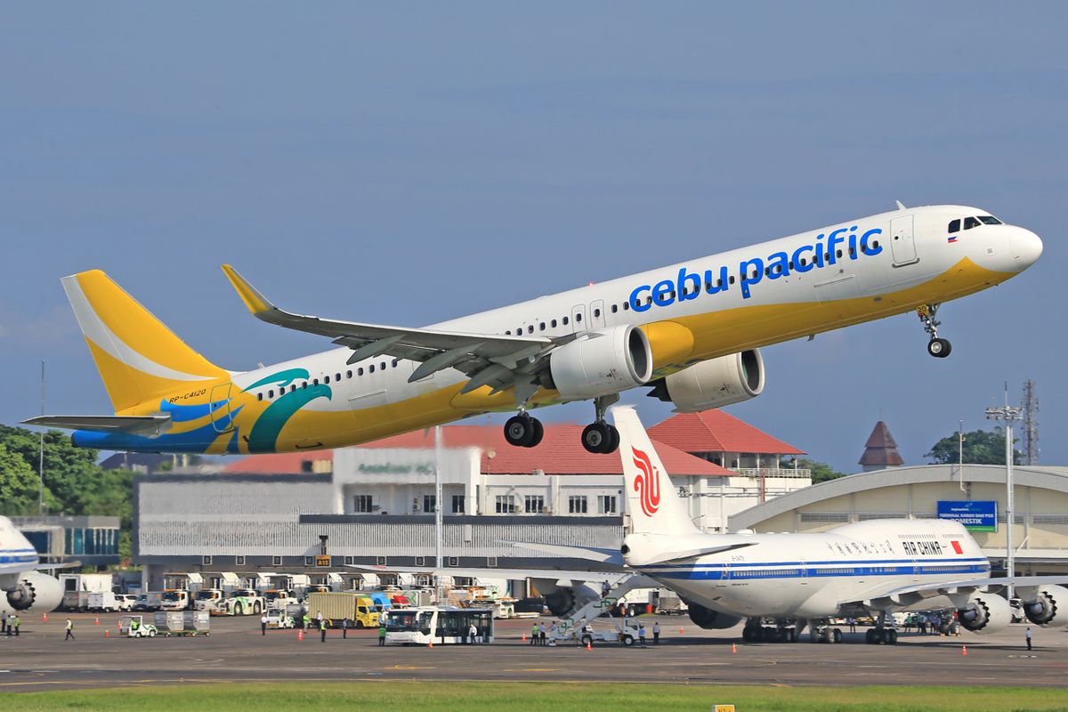 Passenger airplane taking off from an airport runway
