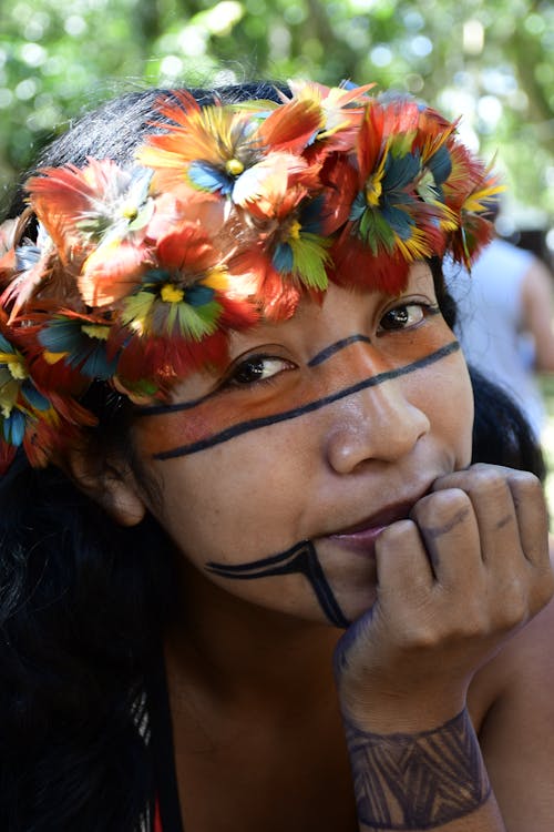 Portrait of a Woman with Face Tattoos Wearing a Flower Crown 