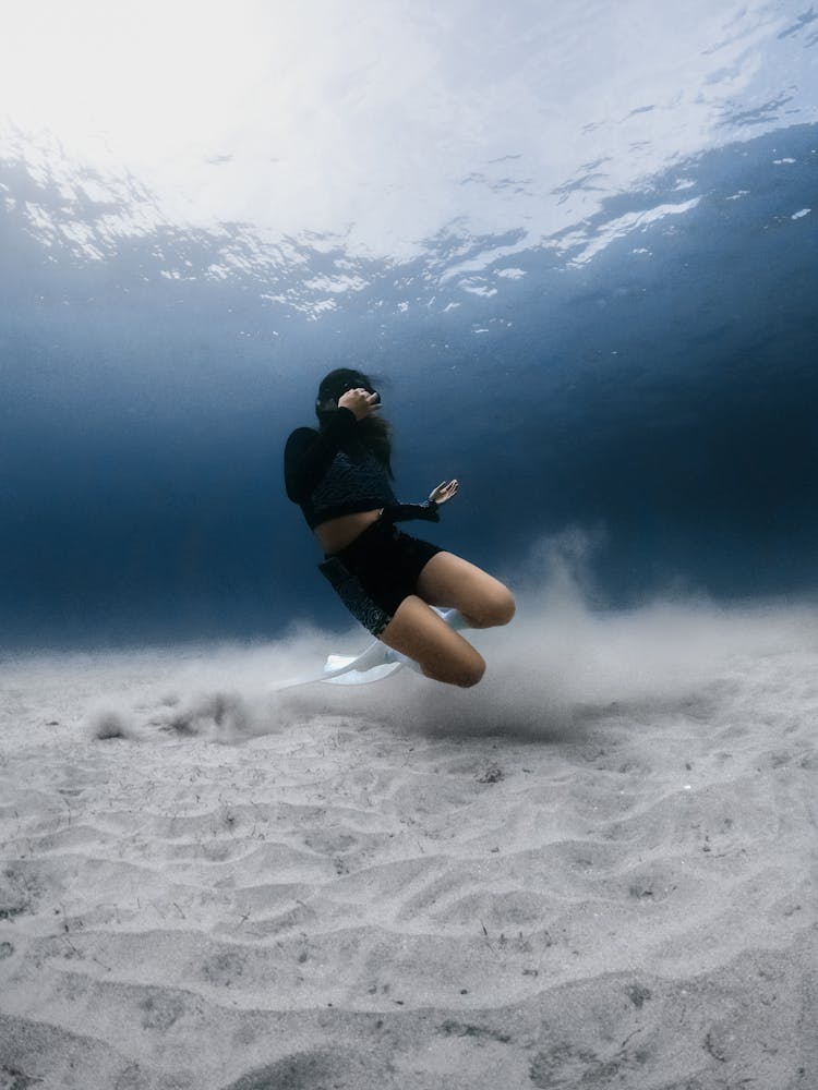 Underwater Photo Of A Woman Diving 