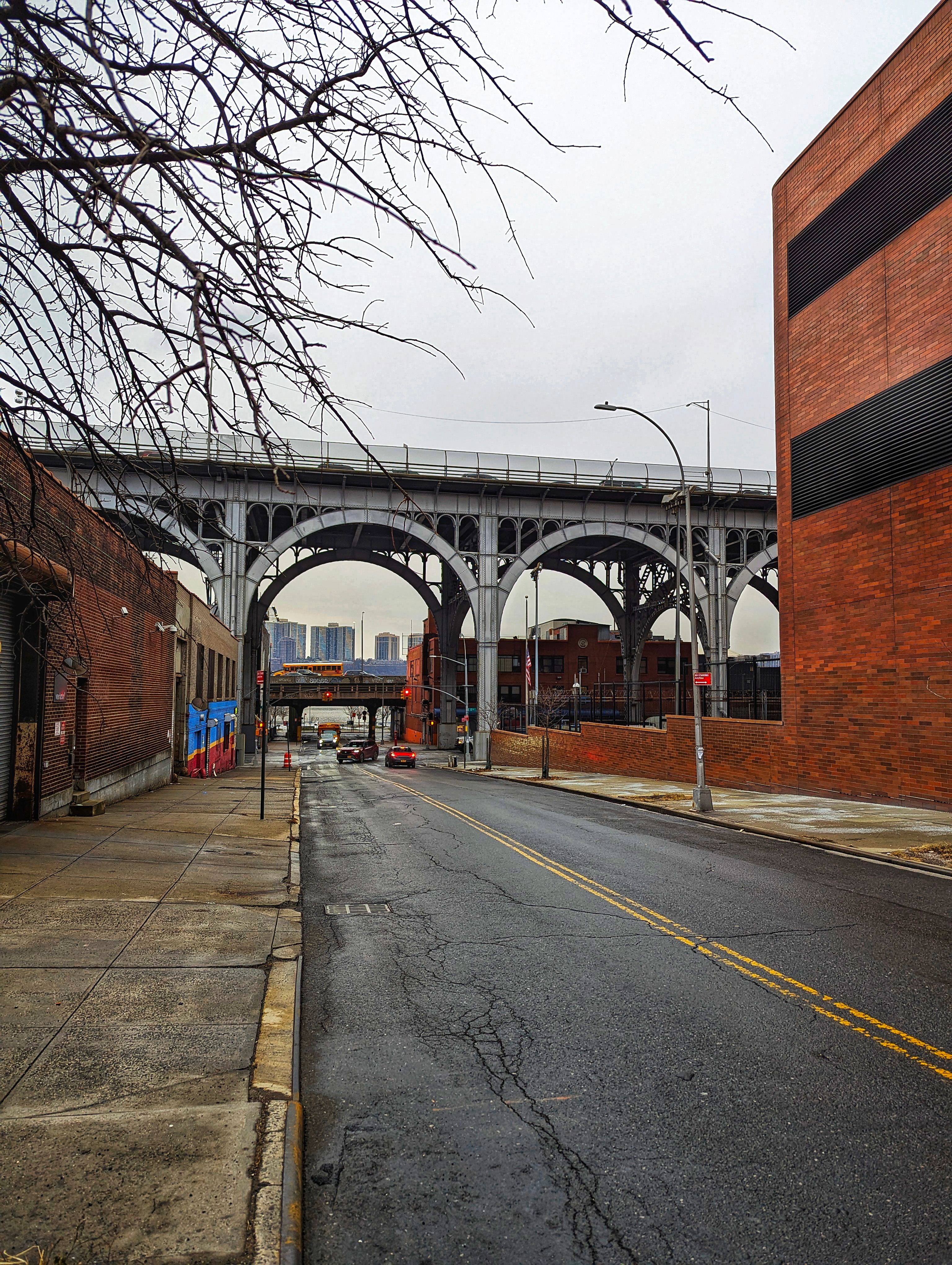 An urban bridge captured in the overcast streets of New York City.