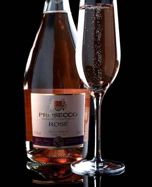 Close-up of a Bottle and Glass of Prosecco Rose 