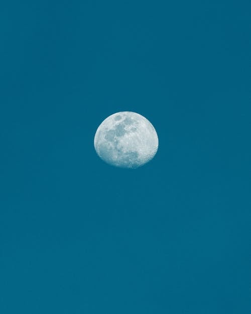 View of the Moon on the Background of Dark Blue Sky 