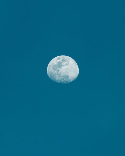 Free A stunning view of the bright full moon against a clear night sky. Stock Photo