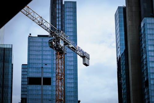 View of Modern Skyscrapers and a Crane in City 