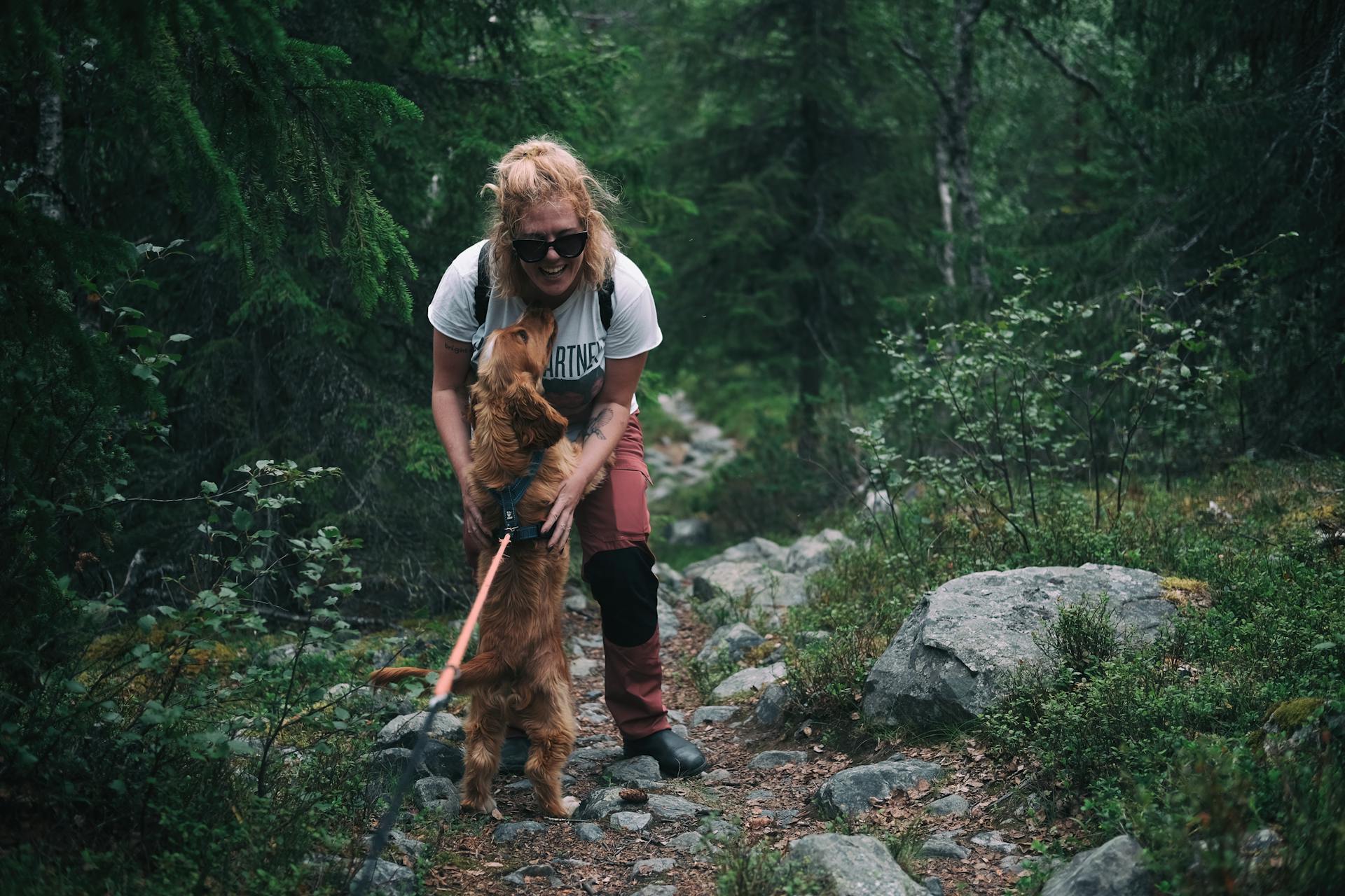 Woman and Dog Expressing Love For Each Other
