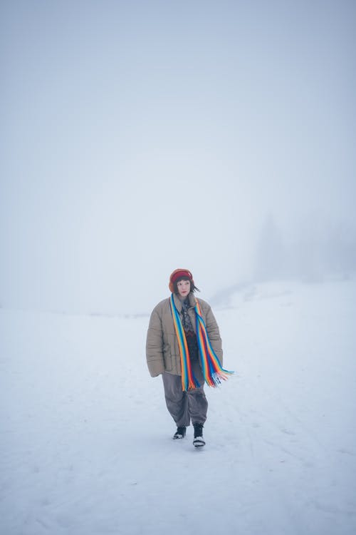Woman Walking Through the Snow