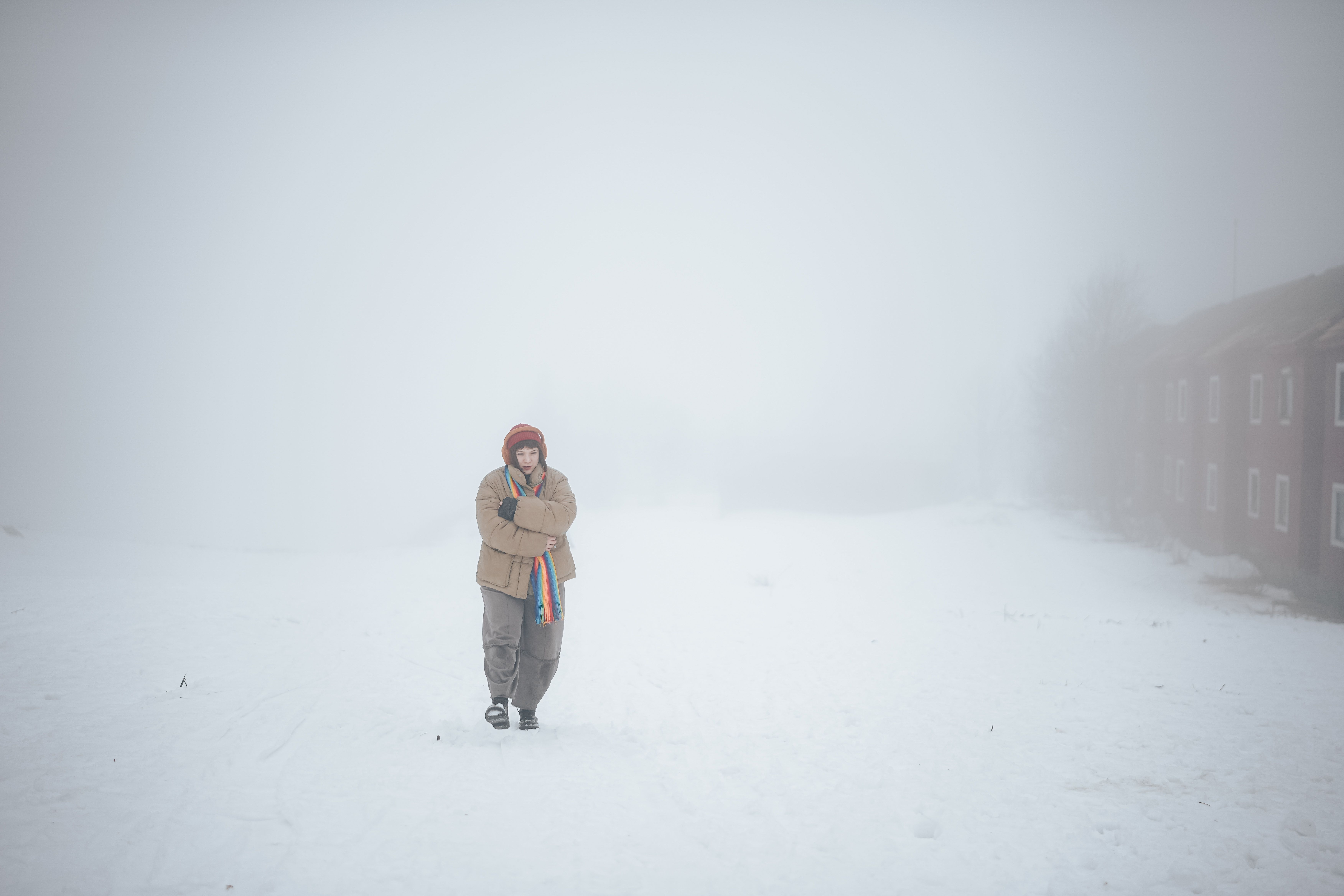 A Girl in Warm Clothing Walking Outside during a Snowstorm · Free Stock ...