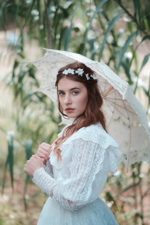 Portrait of Woman in Wedding Dress and with Umbrella