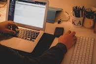 Man Hands around Laptop