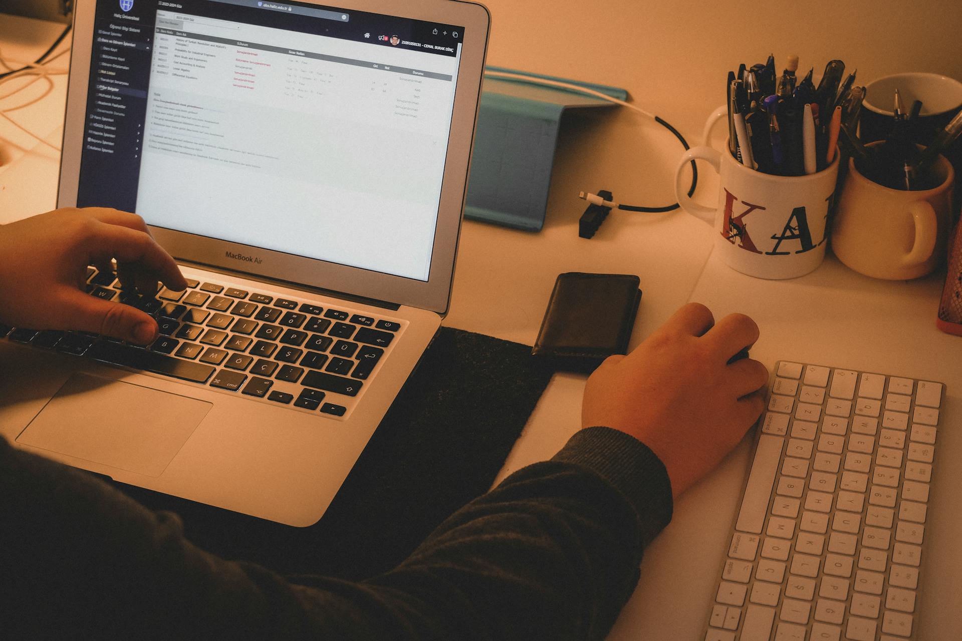 Man Hands around Laptop