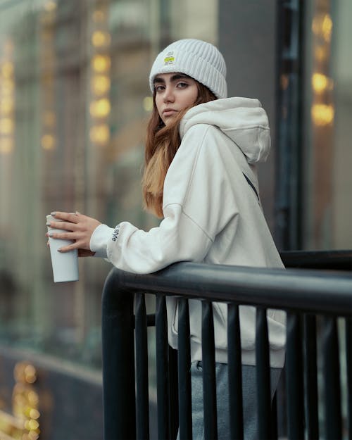 Woman in White Hoodie and Hat