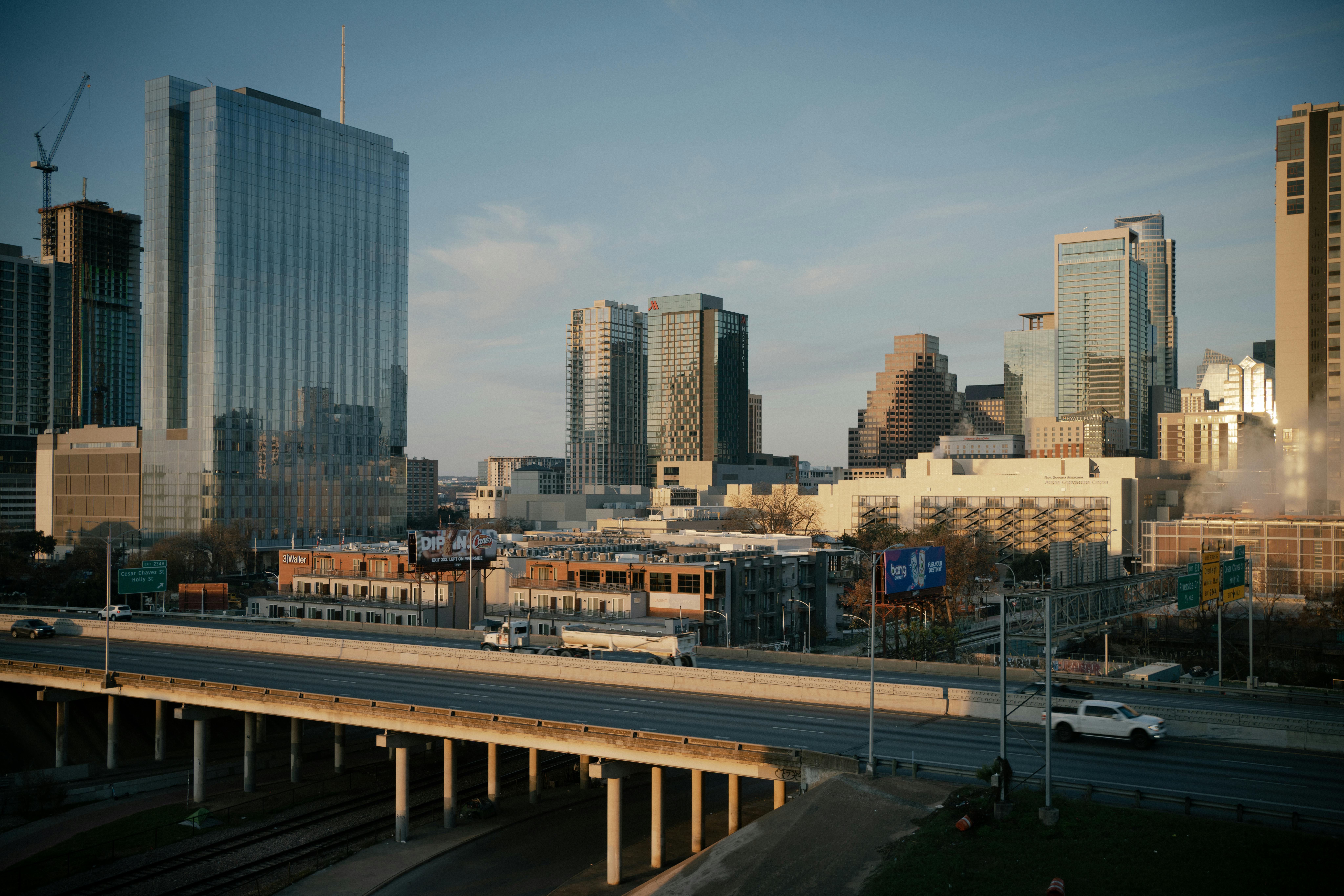 Aerial view of downtown Austin, Texas showcasing modern skyscrapers and urban infrastructure at dusk.