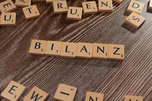 The word blanzn is spelled out in scrabble letters