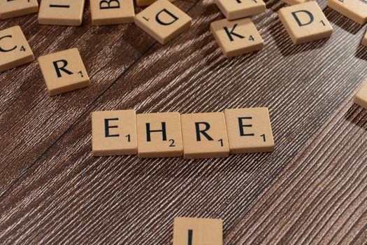 The word ehr on a wooden table with scrabble letters
