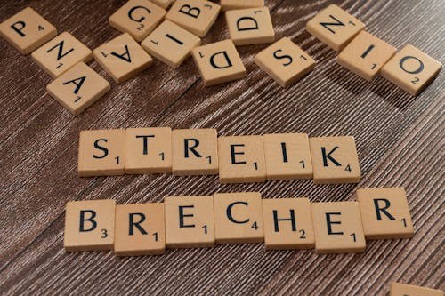 Scrabble tiles with the word streik brecher