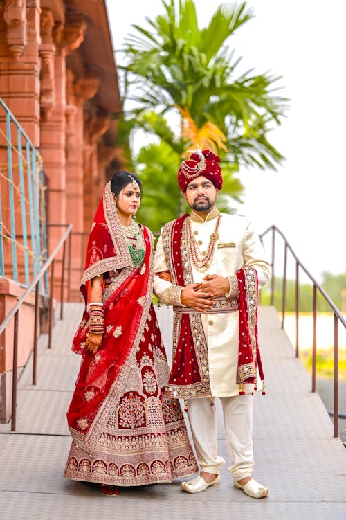 Newlyweds Standing in Traditional Clothing