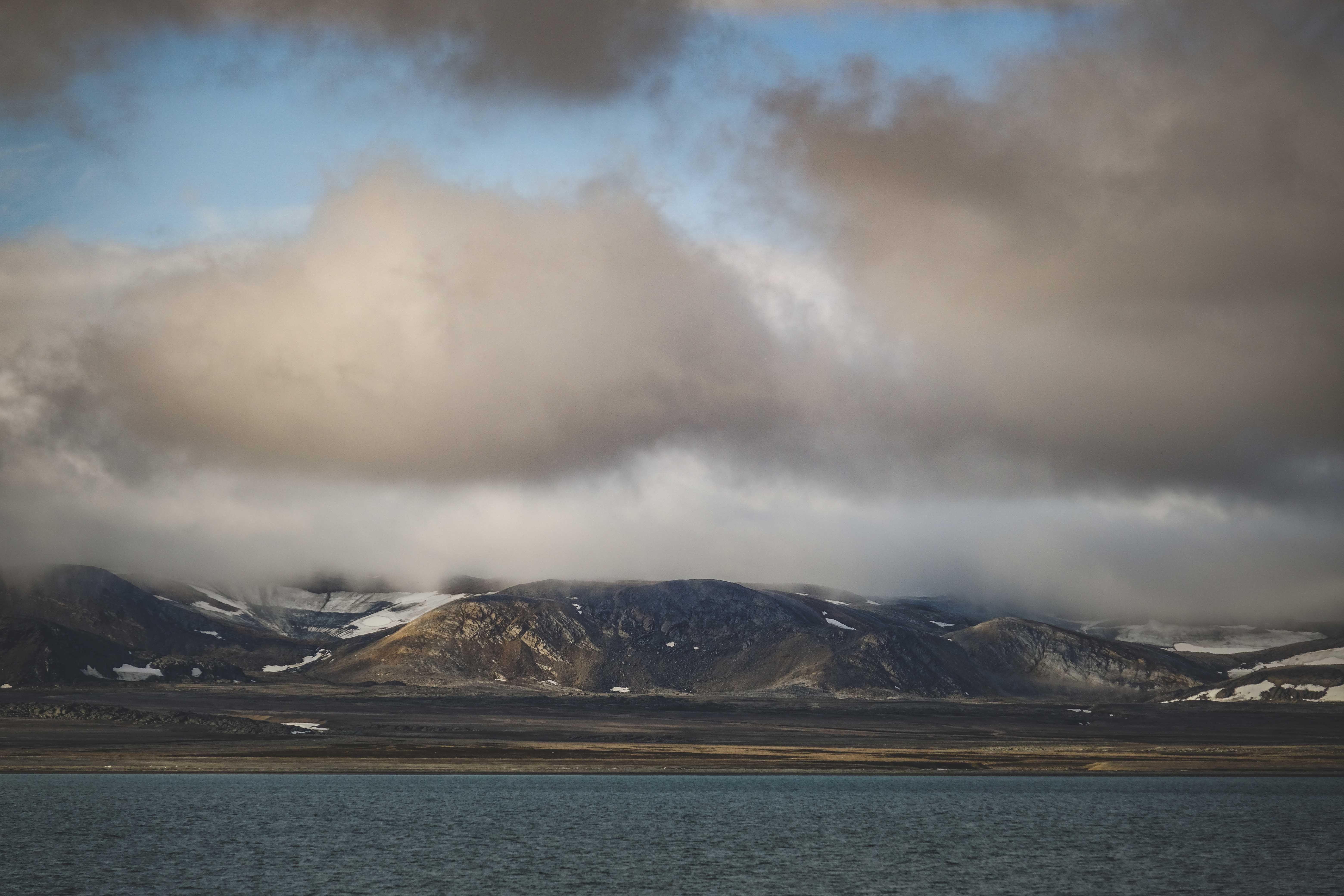 Cloud over Rocky Hill on Coast · Free Stock Photo