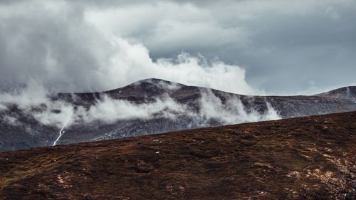 Free Captivating view of misty mountains in Gjevilvasshytta, Trøndelag, Norway. Stock Photo
