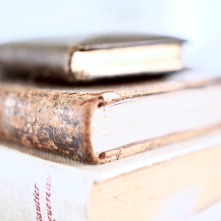 Free Stack of thick books on table Stock Photo