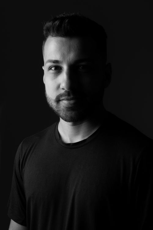 Free Striking black and white portrait of a man with a contemplative expression and short hair. Stock Photo